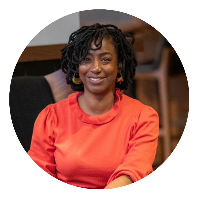 woman sonja thomokins sitting in chair smiling